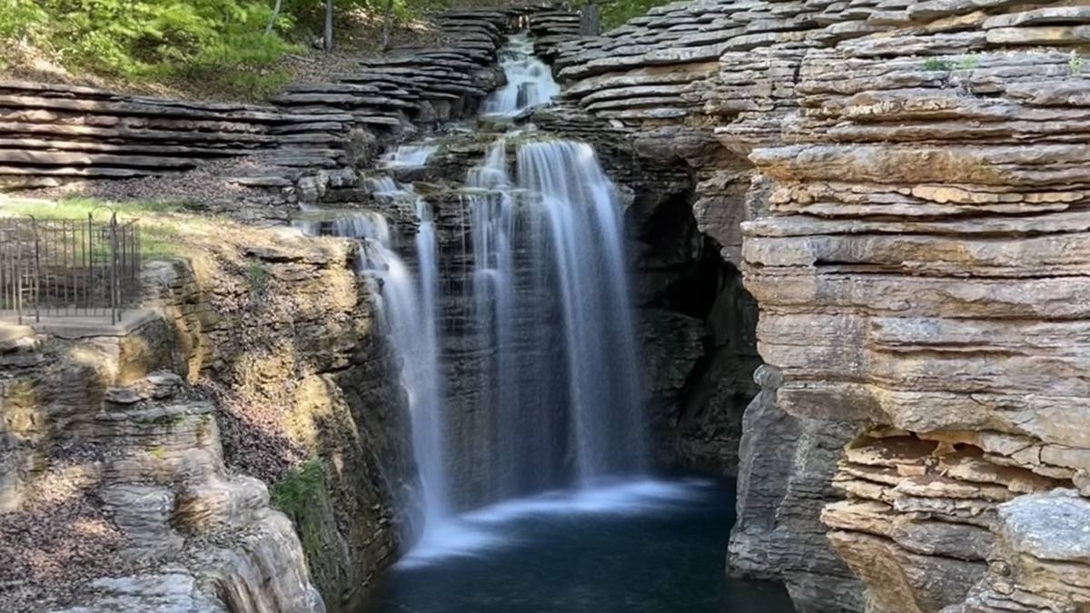 Waterfall with very rugged shelf like rocks around it